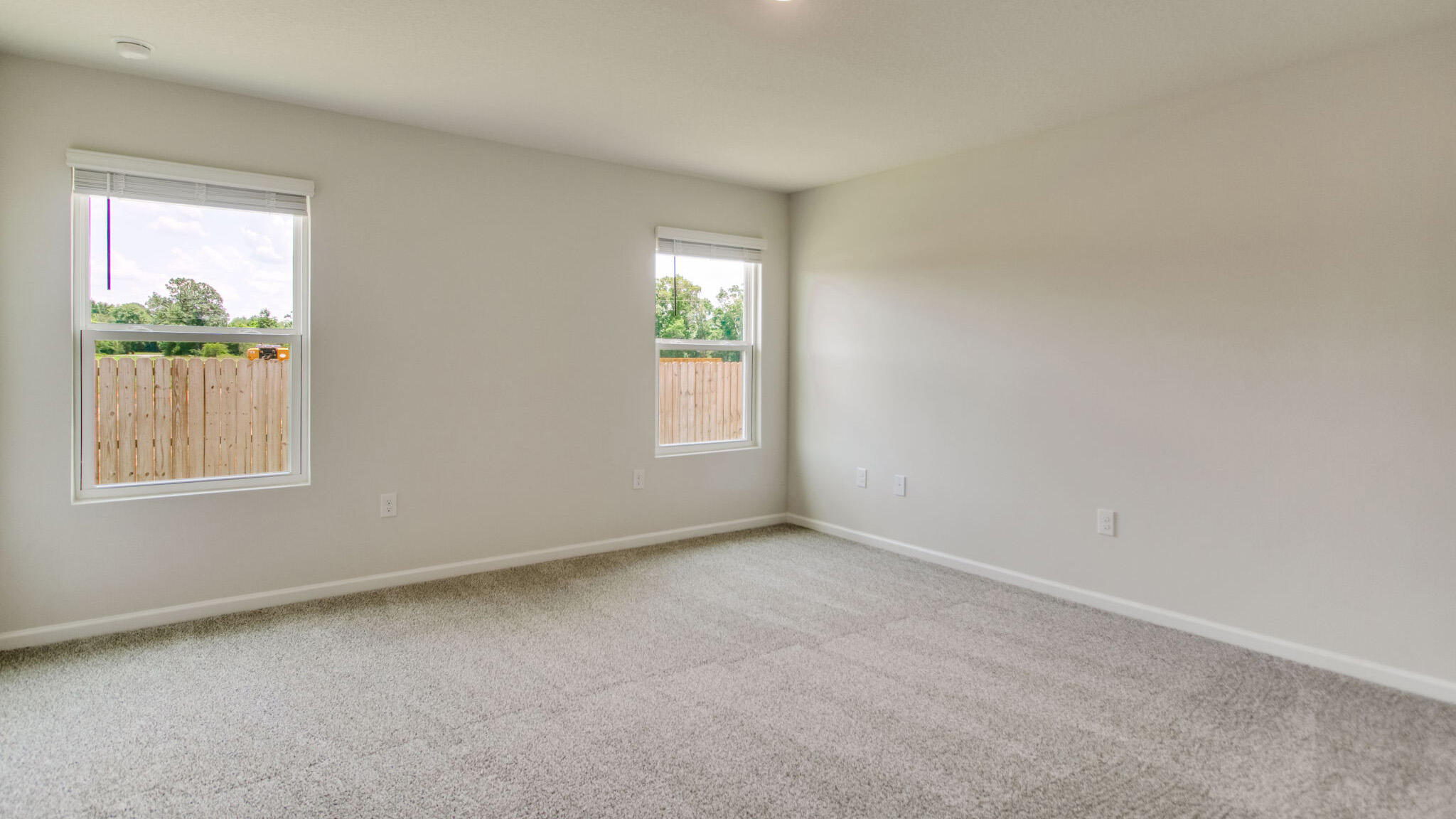 8701 Bluebell Street Milton, FL 32583 - Photo 16 of 32 an empty room with windows