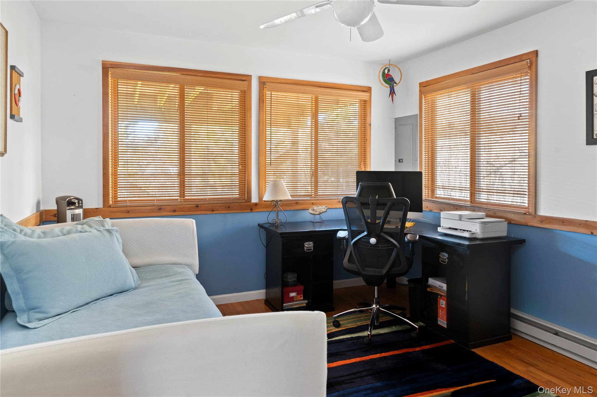 100 Clipper Way Ocean Beach, NY 11770 - Photo 15 of 46 a living room with furniture and floor to ceiling windows