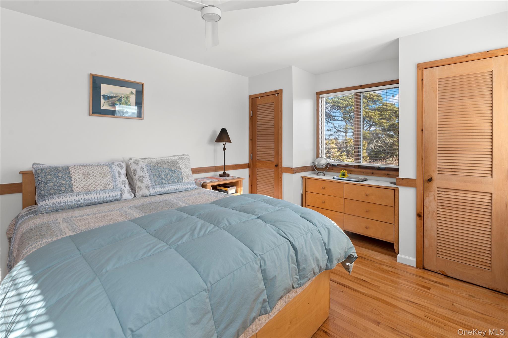 100 Clipper Way Ocean Beach, NY 11770 - Photo 19 of 46 a bedroom with a bed and a large window