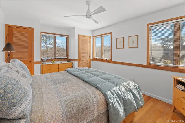 a bedroom with a large bed and a large window