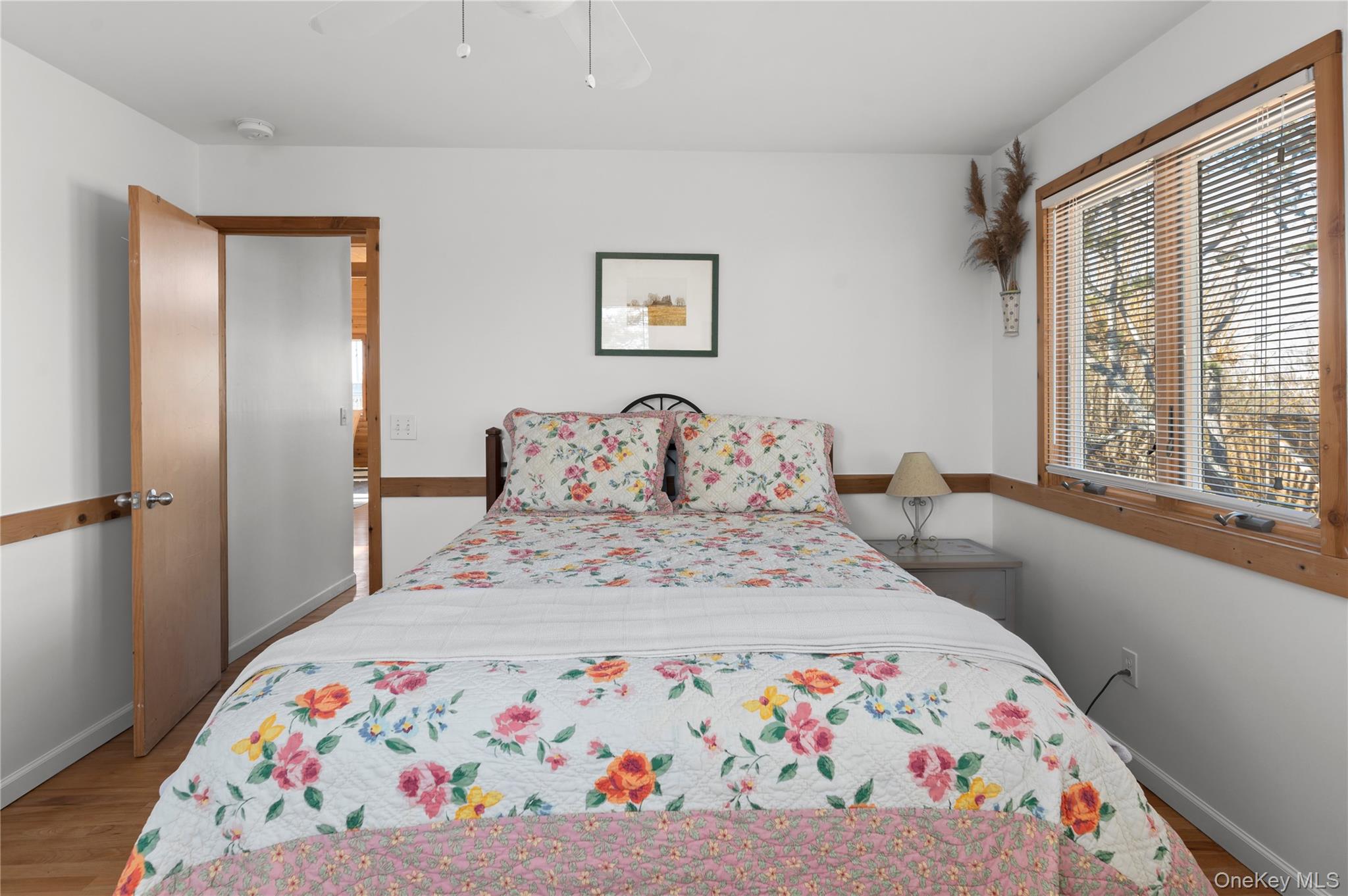 100 Clipper Way Ocean Beach, NY 11770 - Photo 21 of 46 a bedroom with a bed and a window