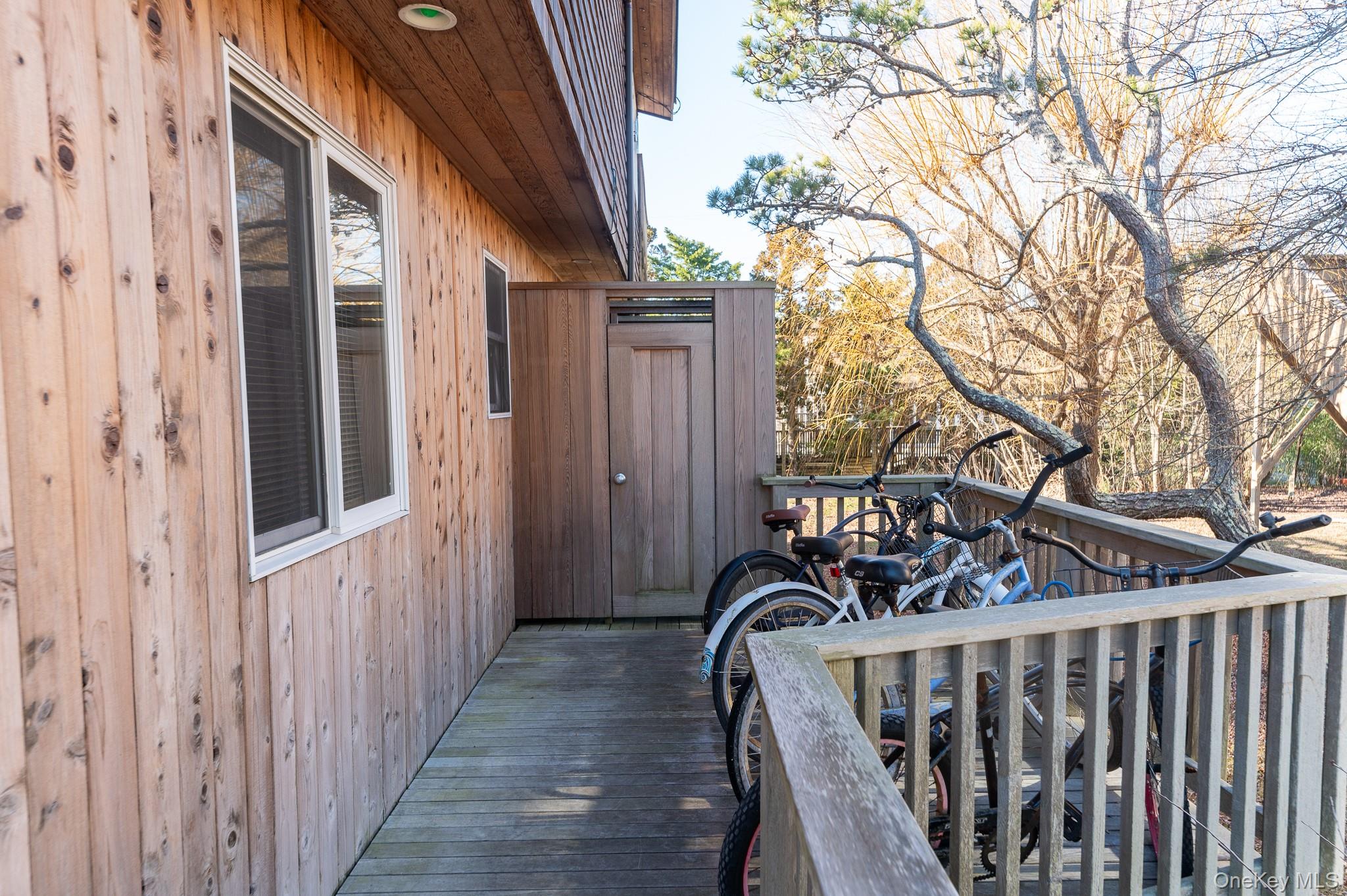 100 Clipper Way Ocean Beach, NY 11770 - Photo 26 of 46 a view of a wooden door with a trees