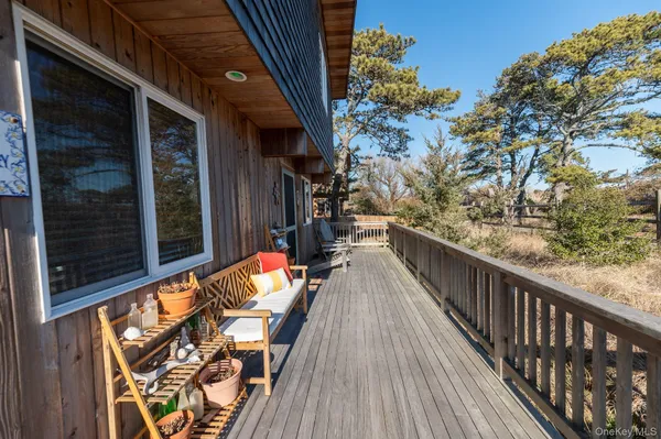 a view of roof deck with furniture