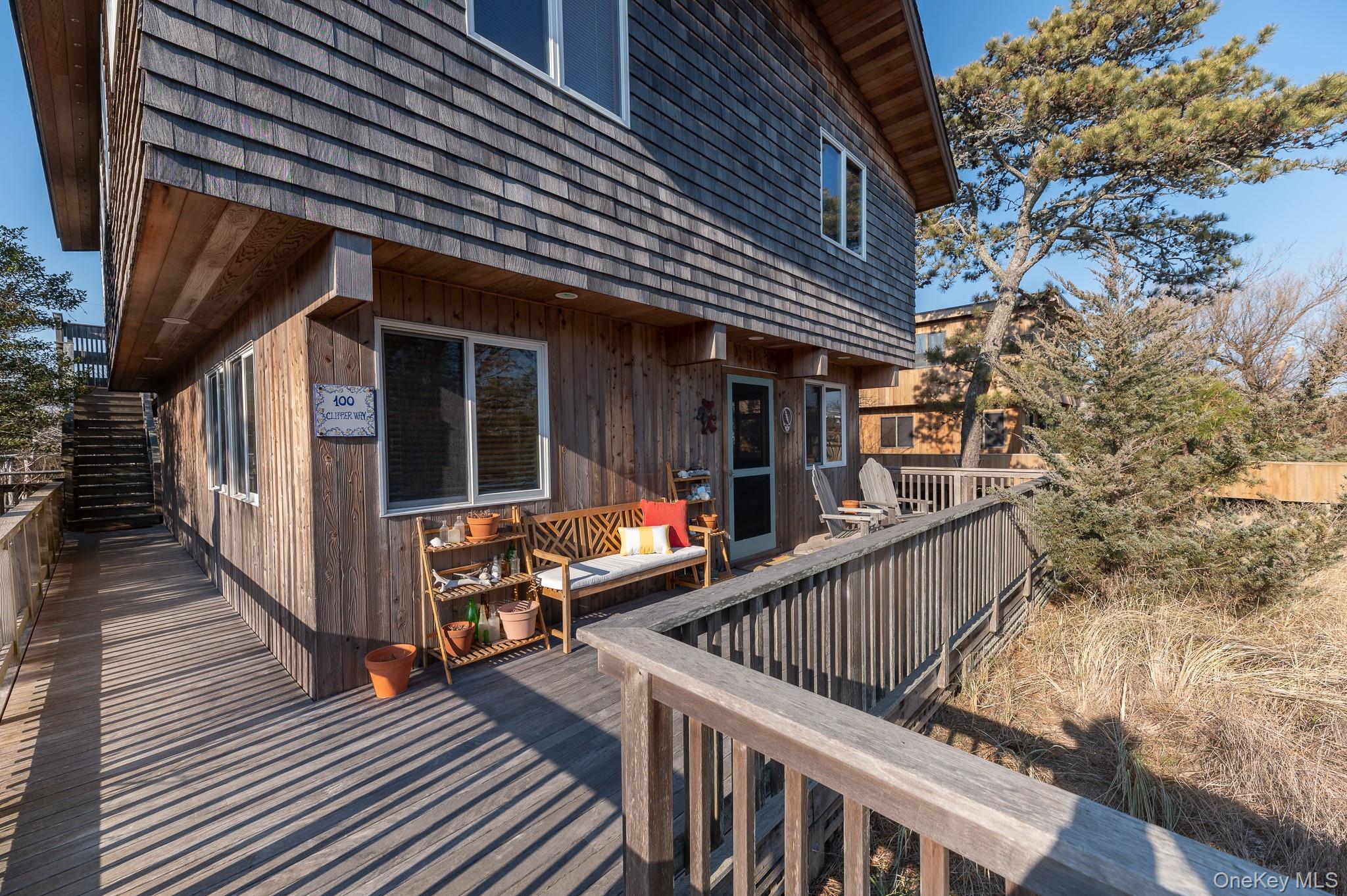 100 Clipper Way Ocean Beach, NY 11770 - Photo 30 of 46 a view of balcony with deck and wooden floor