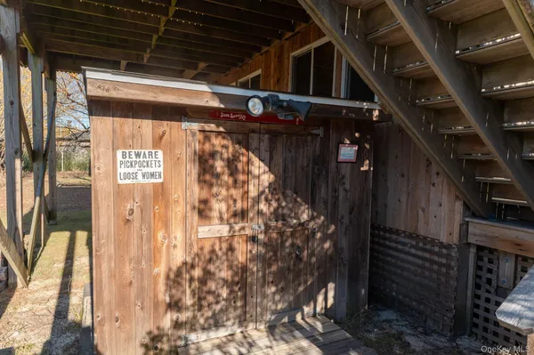 a view of a house with a wooden fence