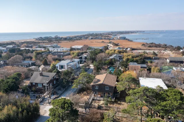a view of a house with wooden deck
