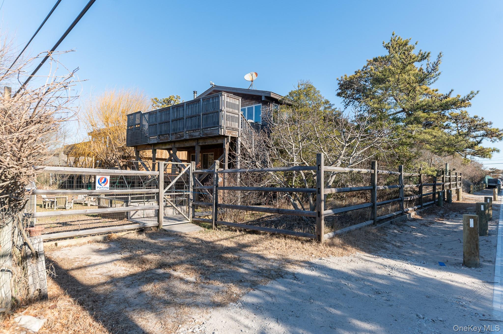 100 Clipper Way Ocean Beach, NY 11770 - Photo 43 of 46 a view of a house with wooden deck