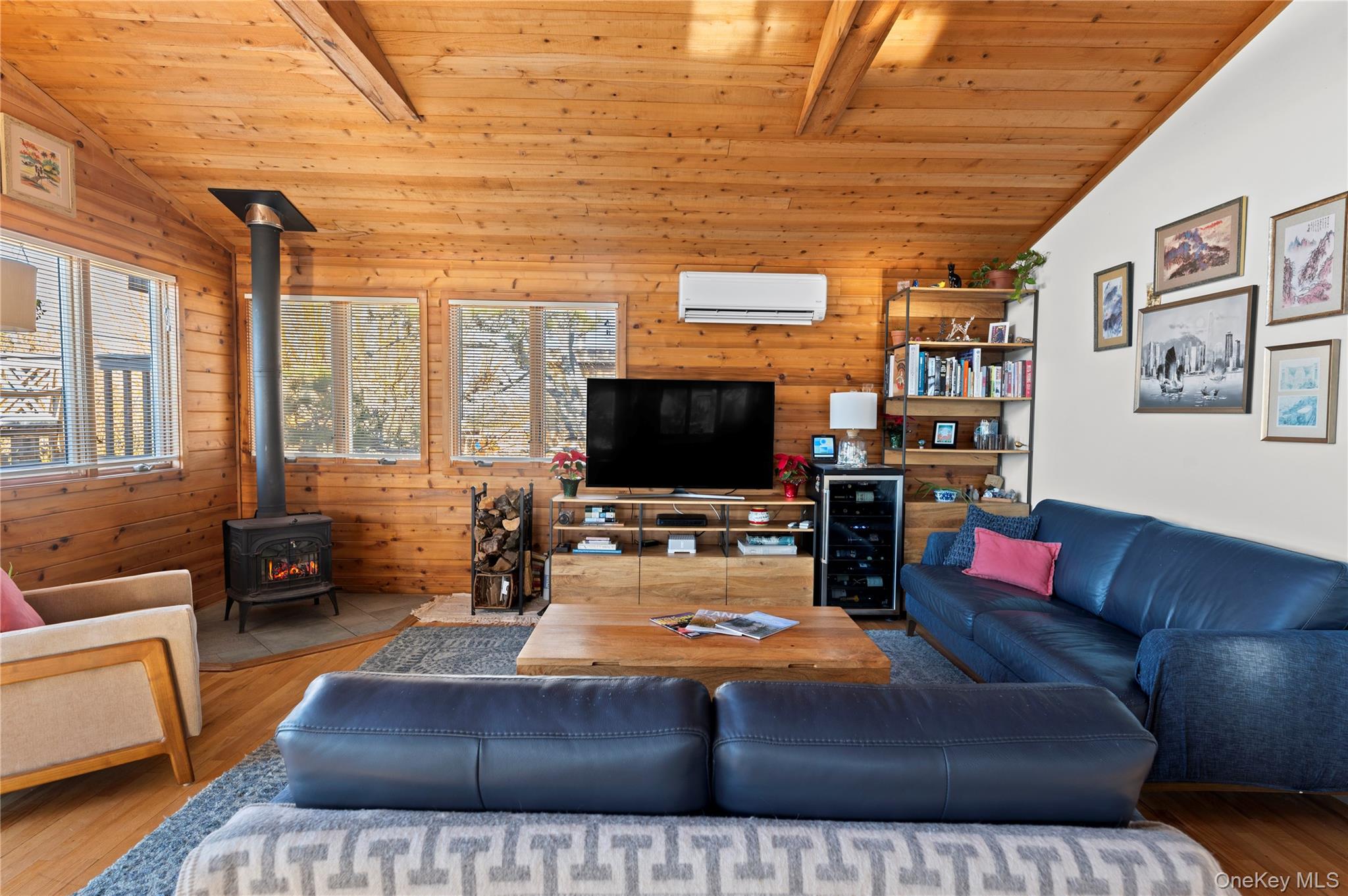 100 Clipper Way Ocean Beach, NY 11770 - Photo 8 of 46 a living room with furniture and a flat screen tv