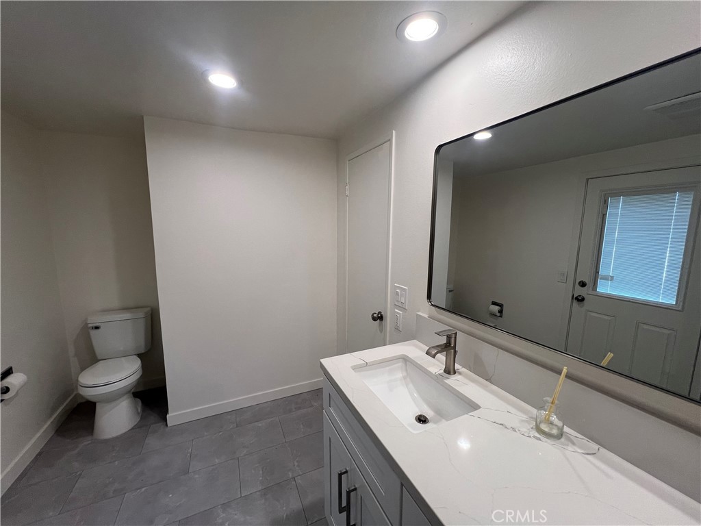 16091 Gold Huntington Beach Huntington Beach, CA 92647 - Photo 8 of 9 a bathroom with a sink and a toilet