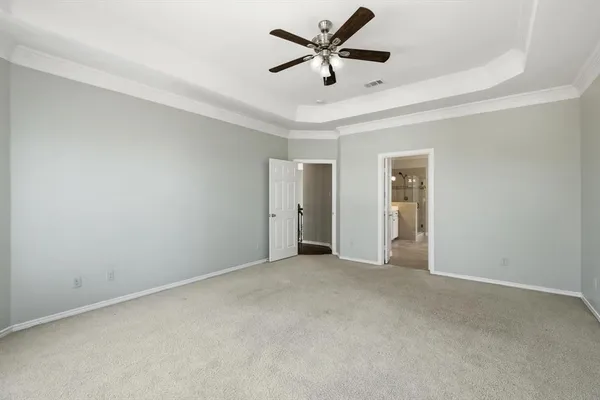 a view of a livingroom with a ceiling fan and window