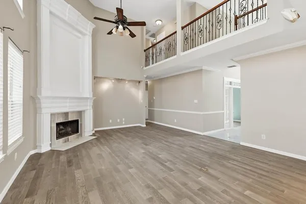 a view of an empty room with a fireplace
