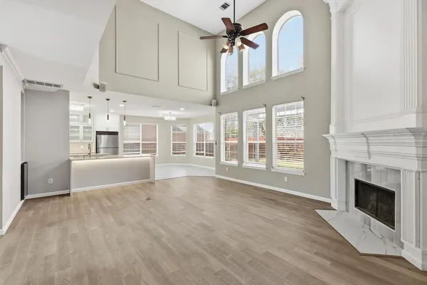 a spacious bathroom with a double vanity sink mirror and bathtub