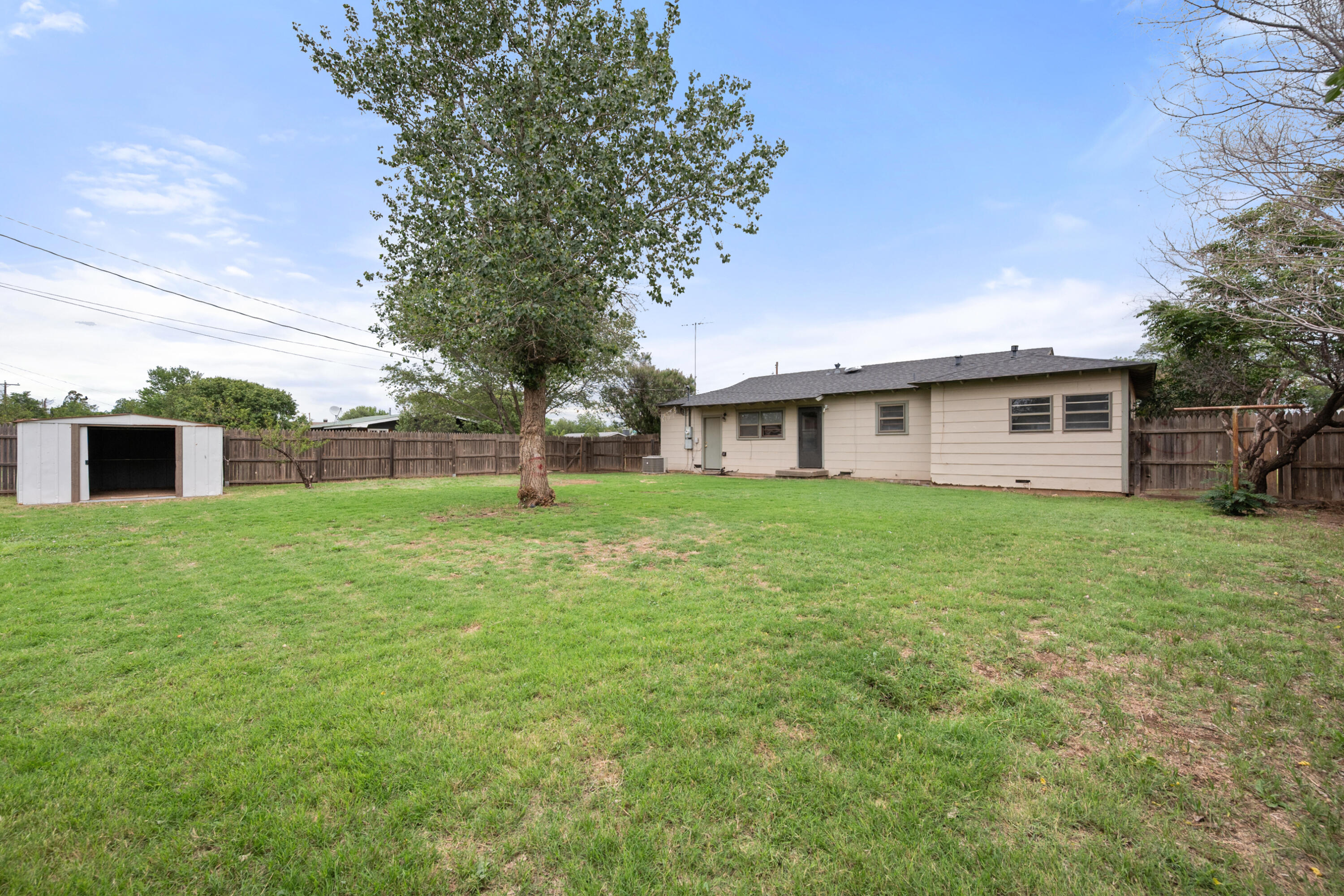811 Zephyr Plainview, TX 79072 - Photo 23 of 25 a front view of house with yard and green space