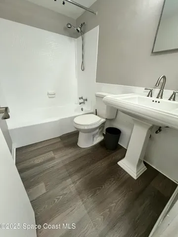 a kitchen with granite countertop cabinets washer and dryer