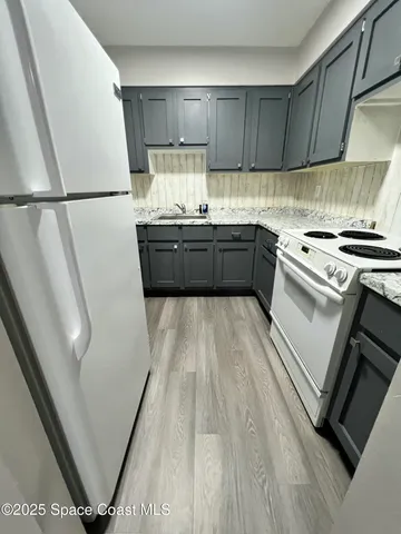 a view of livingroom with furniture and wooden floor