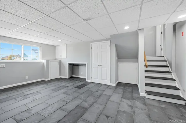 a view of a livingroom with wooden floor and white doors