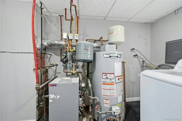 a view of storage and utility room with washer and dryer