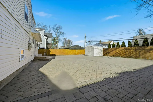 a view of a swimming pool and an outdoor space