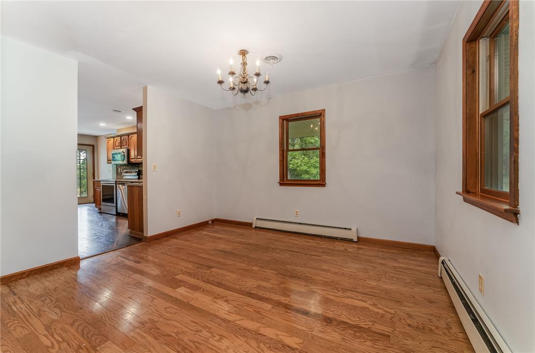 465 Raubsville Road Easton, PA 18042 - Photo 14 of 60 Hardwood floors and ample natural light define this inviting open-concept dining space.