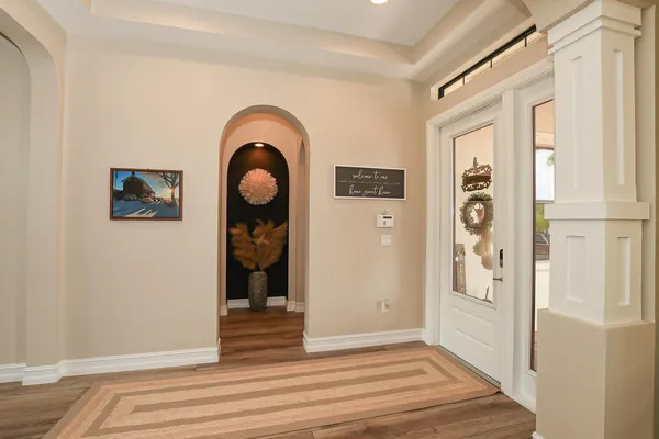 a bedroom with a bed couch and a window