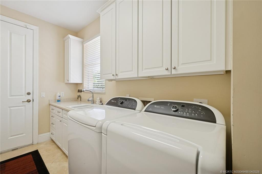 2492 North W Everglades Boulevard Stuart, FL 34994 - Photo 34 of 72 Laundry Room with Ample Storage
