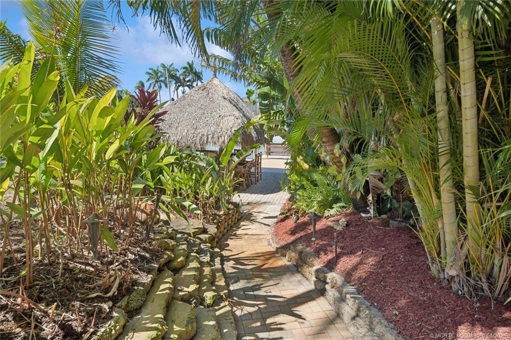 2492 North W Everglades Boulevard Stuart, FL 34994 - Photo 56 of 72 Beautiful Tropical Landscape to your backyard Tiki
