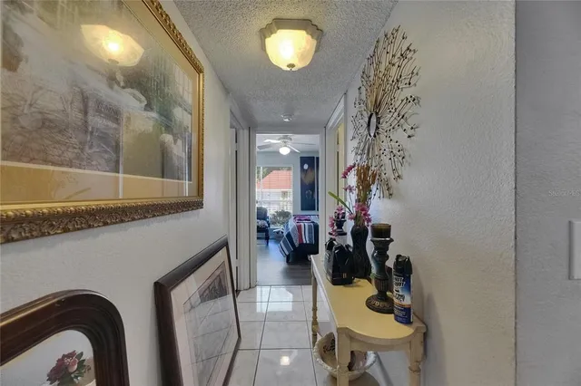 a view of a brick house with a yard and large windows