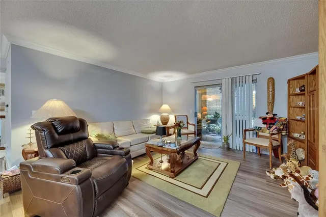 a living room with furniture and a lamp