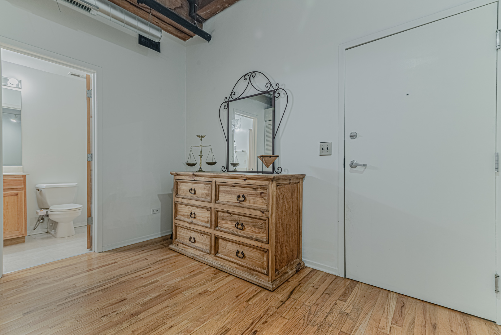 1500 West Monroe Street, Unit 517 Chicago, IL 60607 - Photo 13 of 26 a view of a hallway with wooden floor