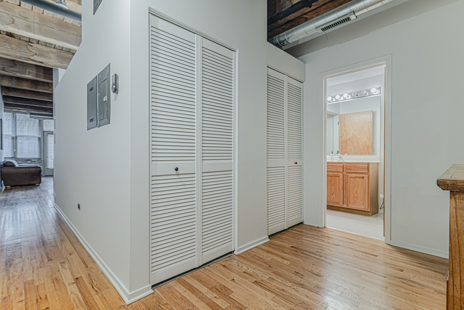 1500 West Monroe Street, Unit 517 Chicago, IL 60607 - Photo 14 of 26 a view of a hallway with wooden floor and closet