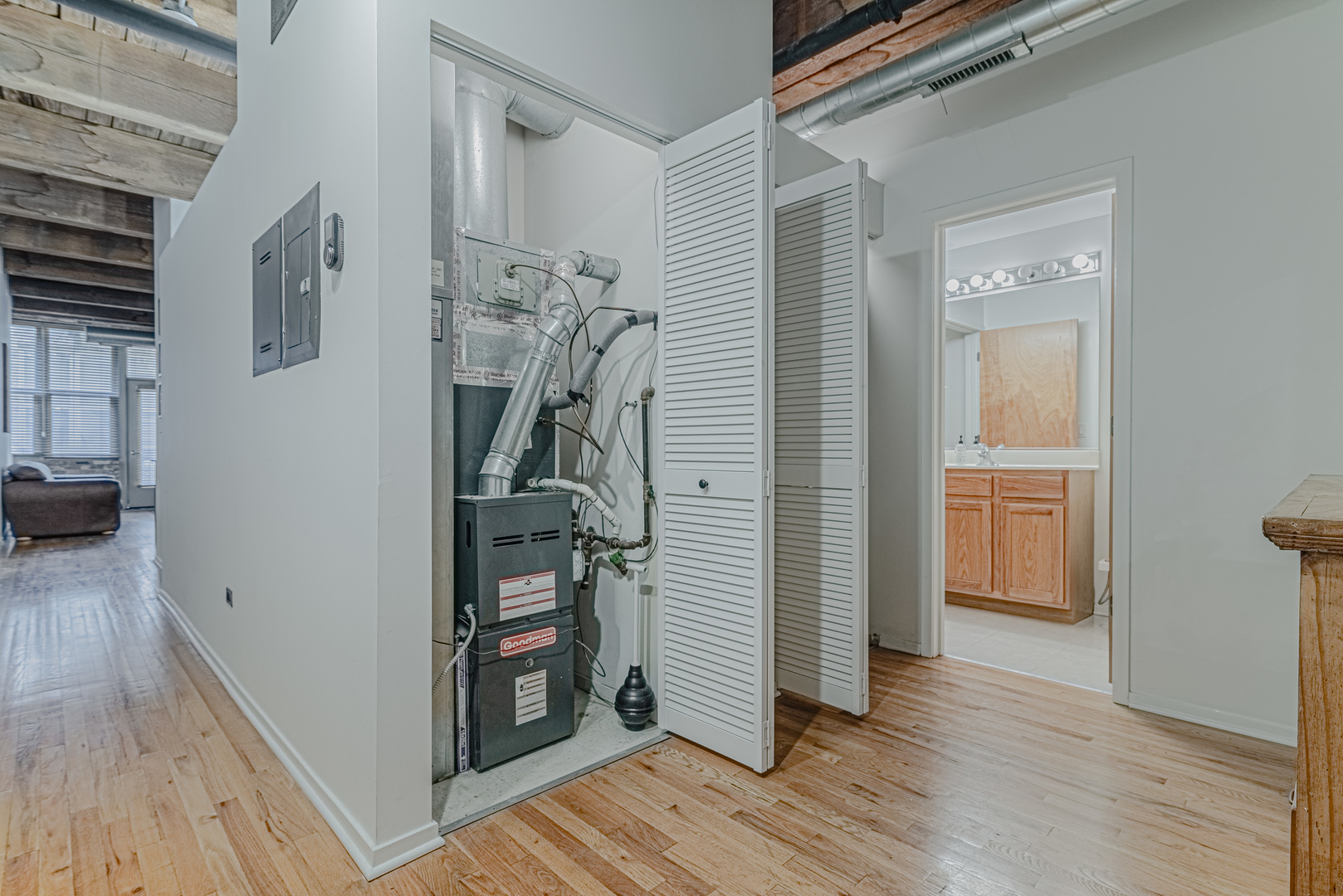 1500 West Monroe Street, Unit 517 Chicago, IL 60607 - Photo 15 of 26 a view of a hallway view with wooden floor and staircase