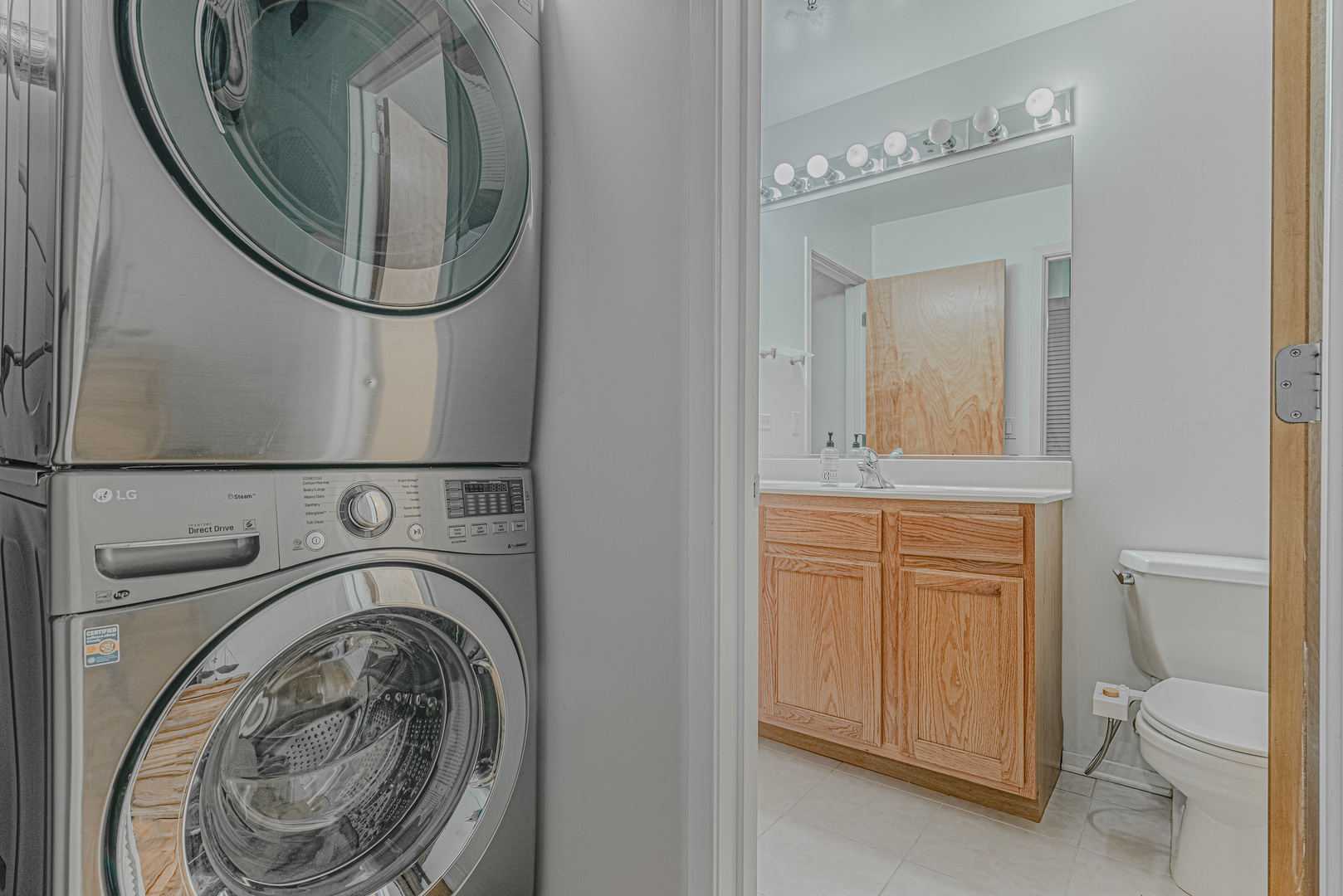 1500 West Monroe Street, Unit 517 Chicago, IL 60607 - Photo 16 of 26 a bathroom with a toilet mirror and vanity