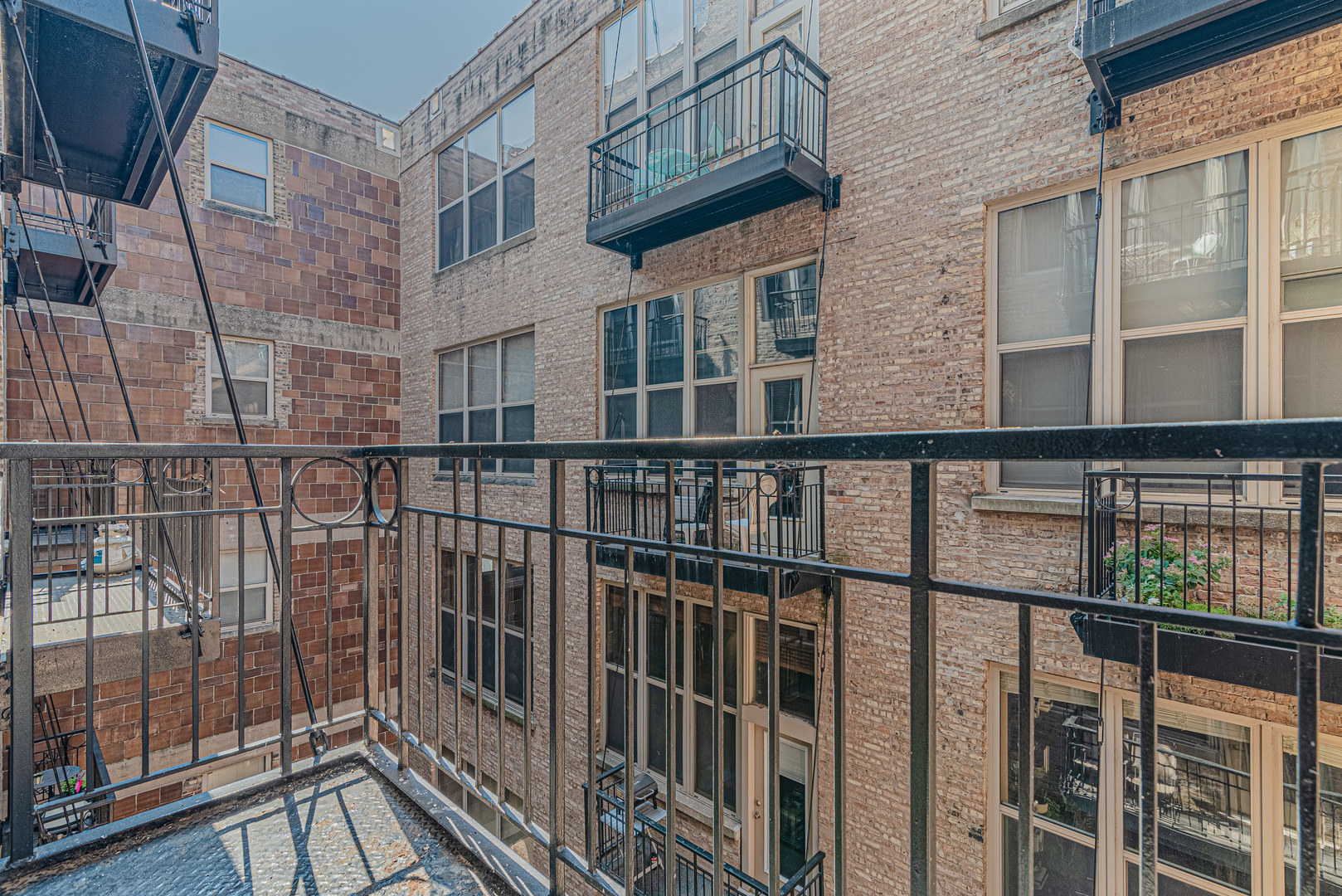 1500 West Monroe Street, Unit 517 Chicago, IL 60607 - Photo 17 of 26 a view of a brick building from a balcony