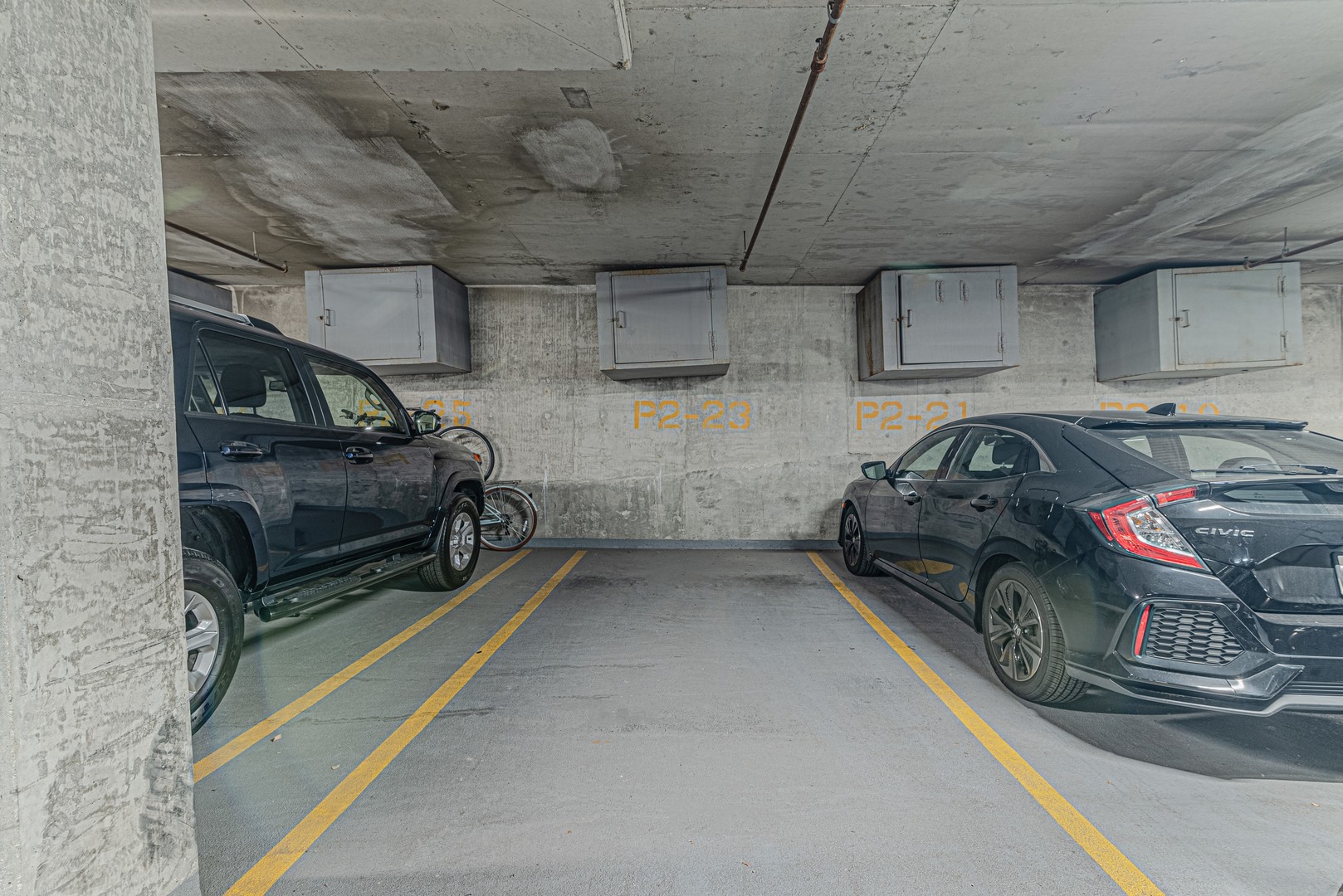 1500 West Monroe Street, Unit 517 Chicago, IL 60607 - Photo 24 of 26 a view of parking garage with cars parked