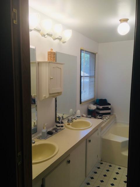 1315 Depot Road Blue Ridge, VA 24064 - Photo 4 of 17 a bathroom with a sink a vanity and mirror