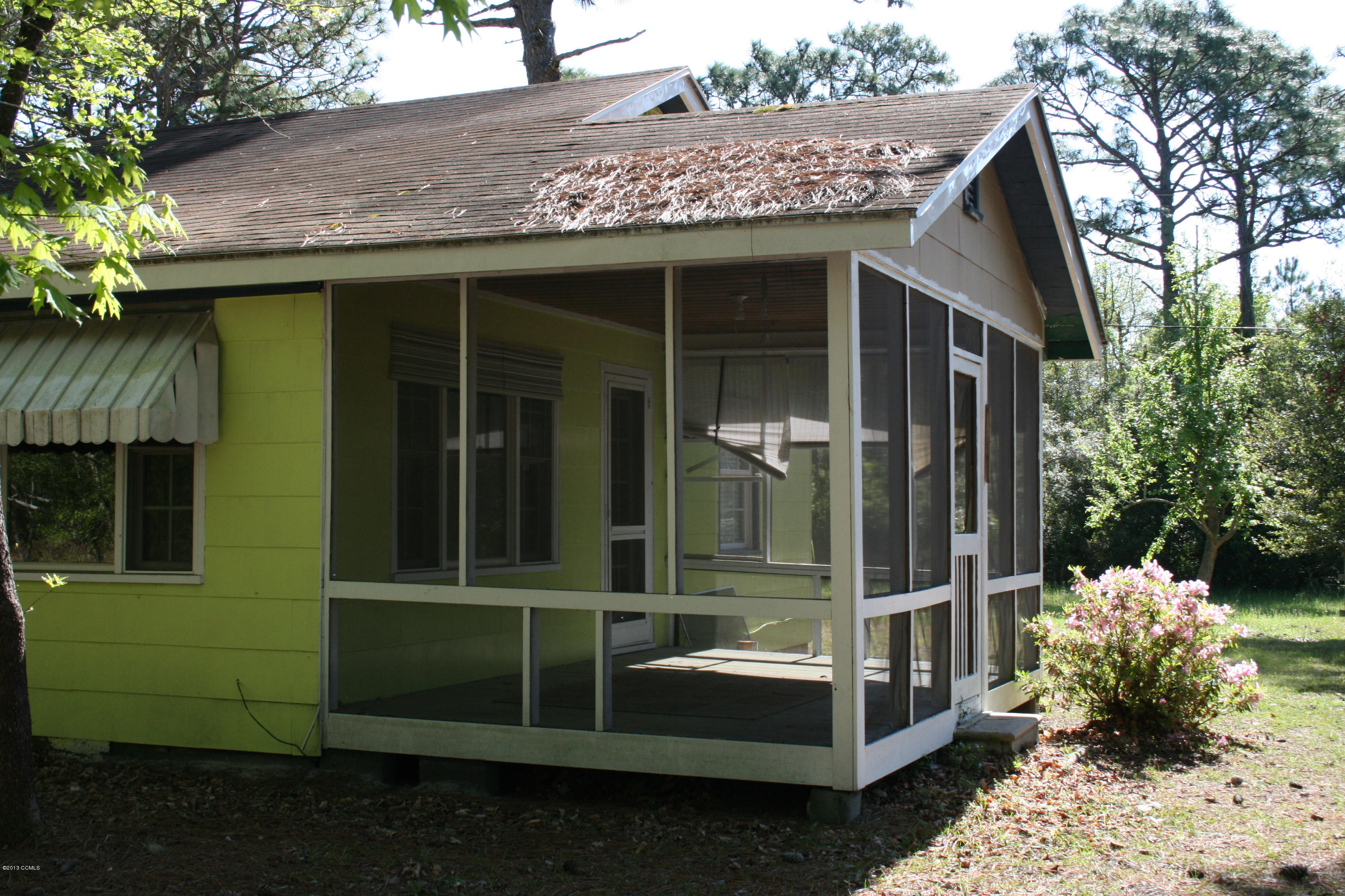 157 Hibbs Road Newport, NC 28570 - Photo 12 of 15 157 Hibbs Rd Ext screened in porch