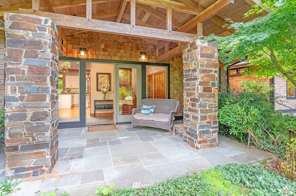 18132 Thorsen Road Southwest Vashon, WA 98070 - Photo 2 of 40 a view of a patio with table and chairs and potted plants