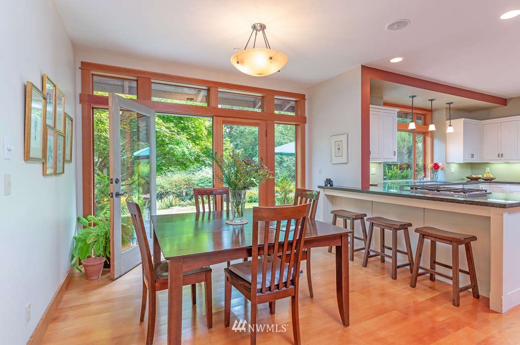 18132 Thorsen Road Southwest Vashon, WA 98070 - Photo 15 of 40 a view of a dining room with furniture window and outside view