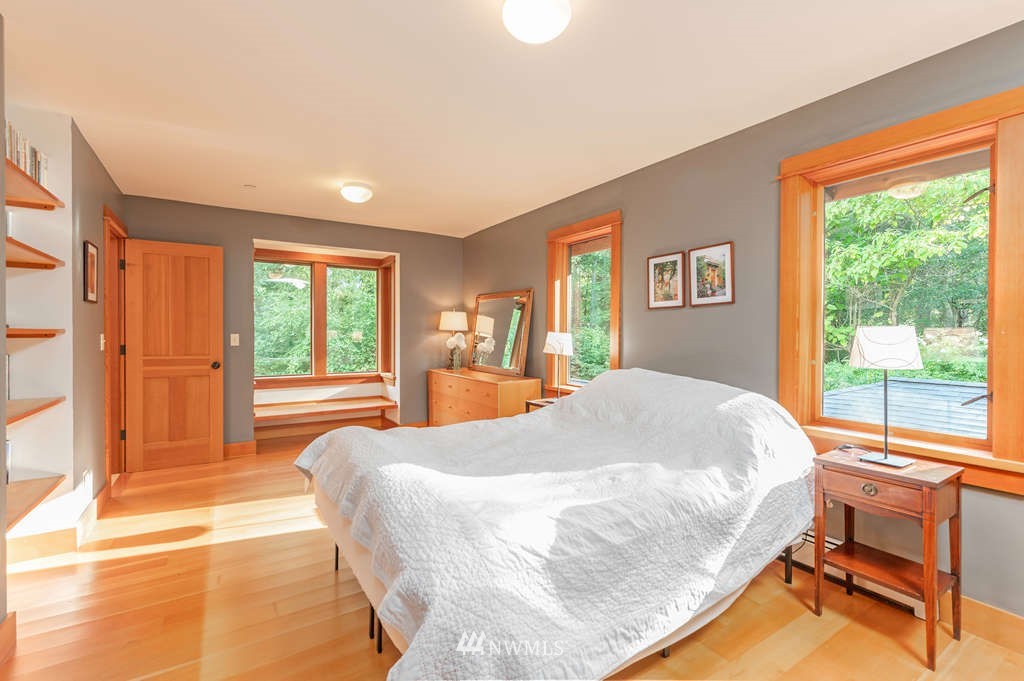 18132 Thorsen Road Southwest Vashon, WA 98070 - Photo 20 of 40 a bed sitting in a bedroom next to a window
