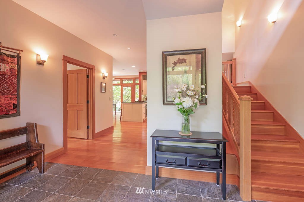 18132 Thorsen Road Southwest Vashon, WA 98070 - Photo 3 of 40 a living room with furniture and a potted plant
