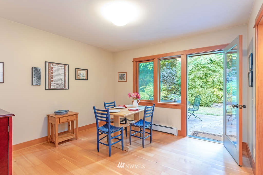 18132 Thorsen Road Southwest Vashon, WA 98070 - Photo 29 of 40 a view of a dining room with furniture window and outside view