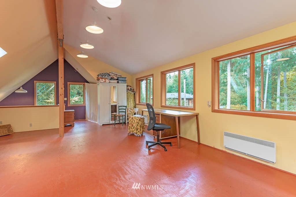 18132 Thorsen Road Southwest Vashon, WA 98070 - Photo 36 of 40 a view of a livingroom with furniture and a large window