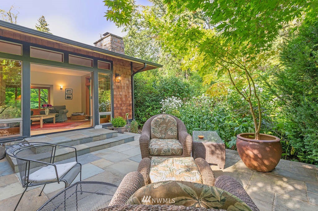 18132 Thorsen Road Southwest Vashon, WA 98070 - Photo 8 of 40 a view of a patio with table and chairs and potted plants
