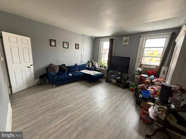 a bed room with furniture and a window