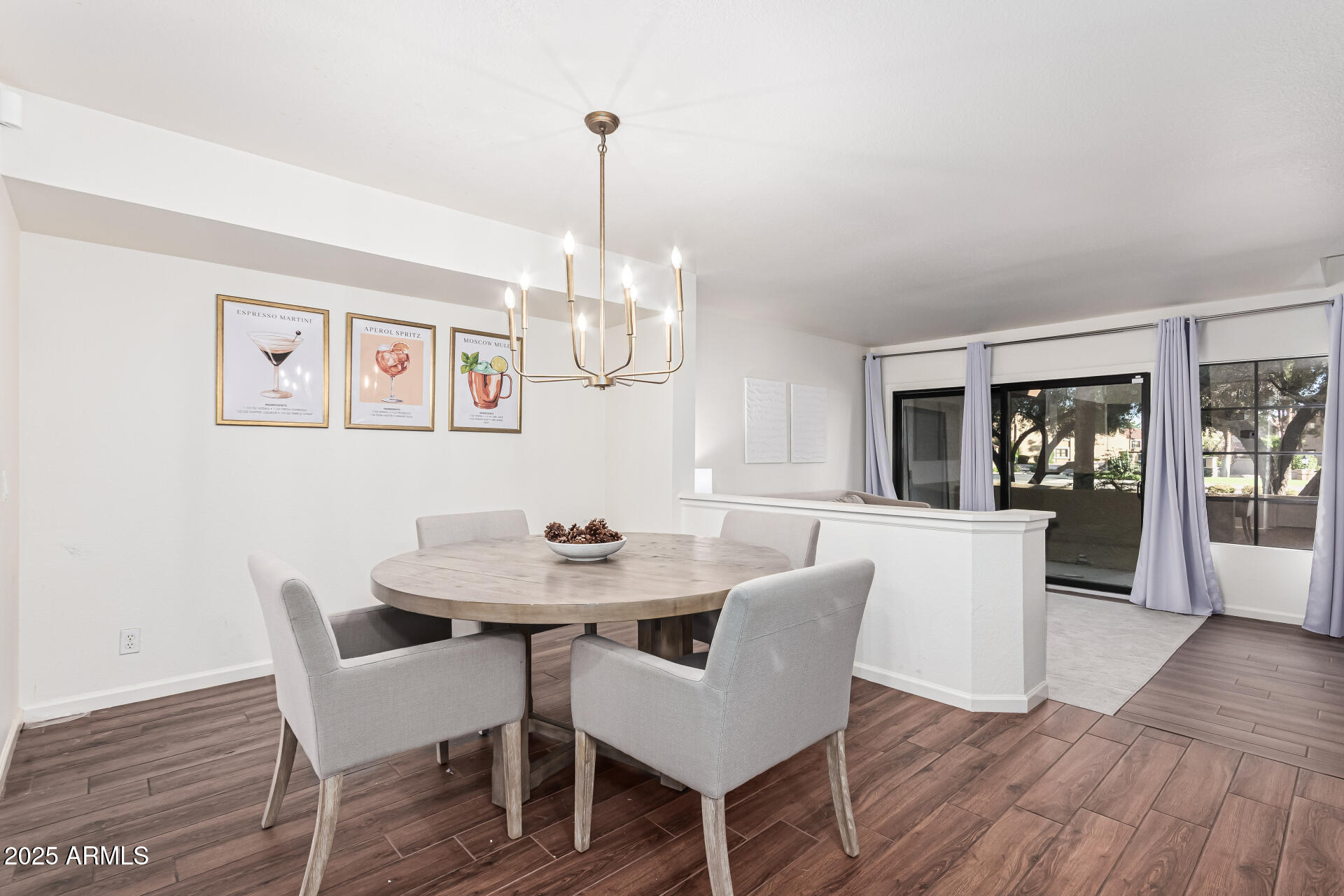 8700 East Mountain View Road, Unit 1039 Scottsdale, AZ 85258 - Photo 13 of 37 a view of a dining room with furniture wooden floor and chandelier