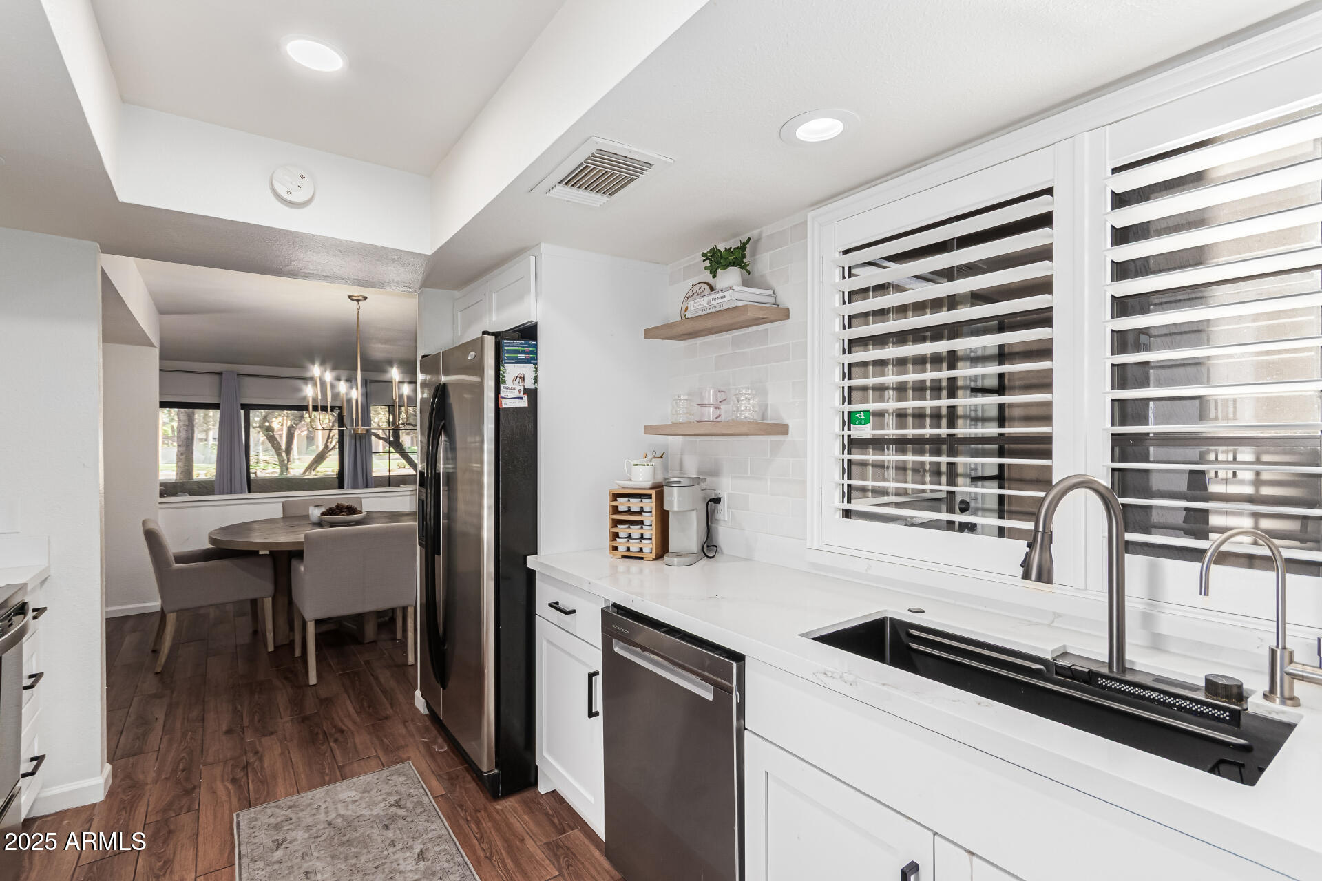 8700 East Mountain View Road, Unit 1039 Scottsdale, AZ 85258 - Photo 14 of 37 a kitchen with a refrigerator and a sink