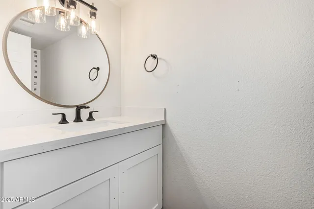 a kitchen with a refrigerator and a sink