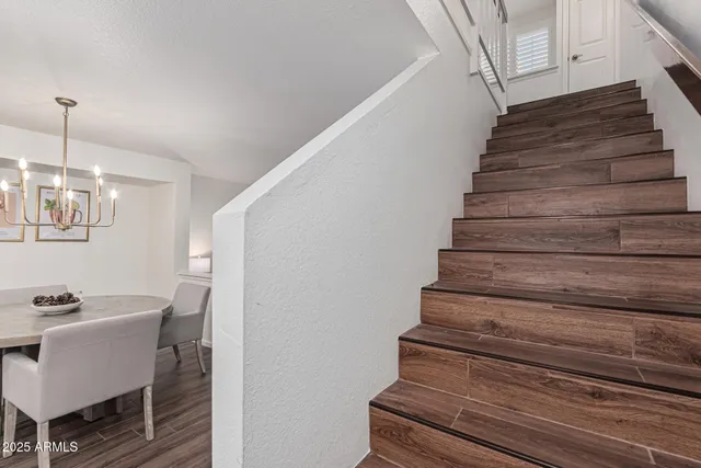 a kitchen with granite countertop a sink stove and cabinets