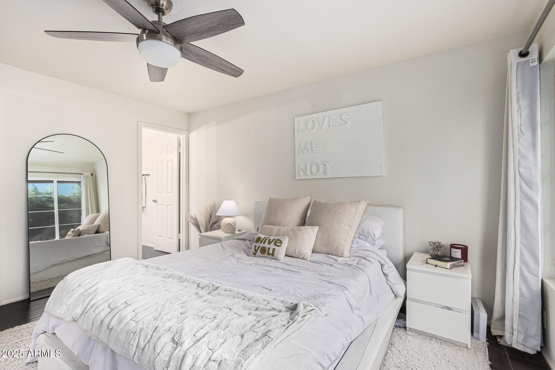 8700 East Mountain View Road, Unit 1039 Scottsdale, AZ 85258 - Photo 21 of 37 a bedroom with a bed and a mirror