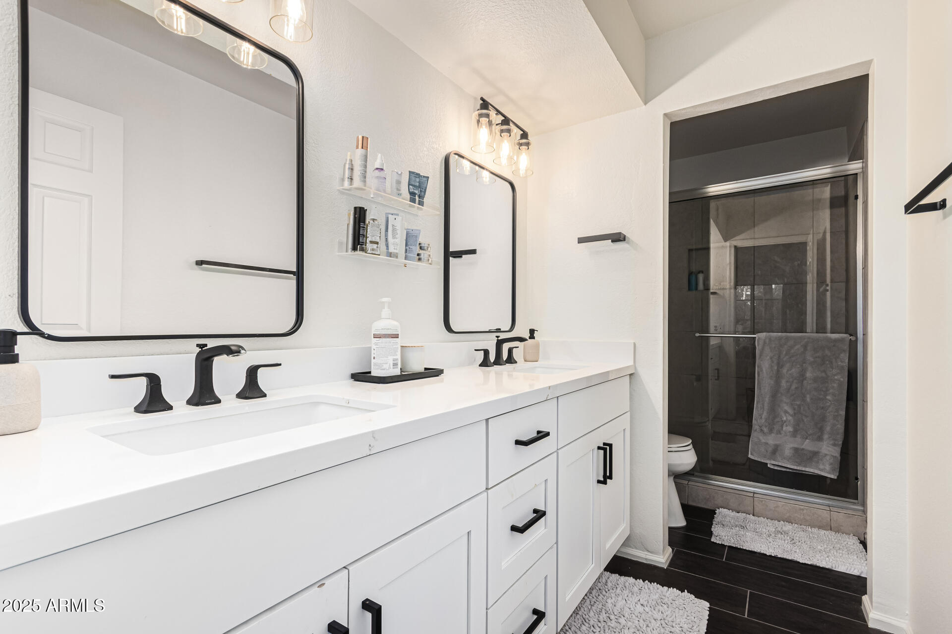 8700 East Mountain View Road, Unit 1039 Scottsdale, AZ 85258 - Photo 23 of 37 a bathroom with double vanity sink and a mirror